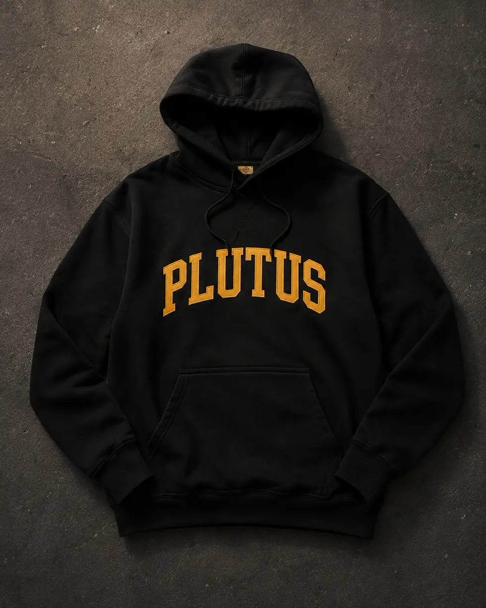 The black PLUTUS hoodie laid flat on dark concrete.