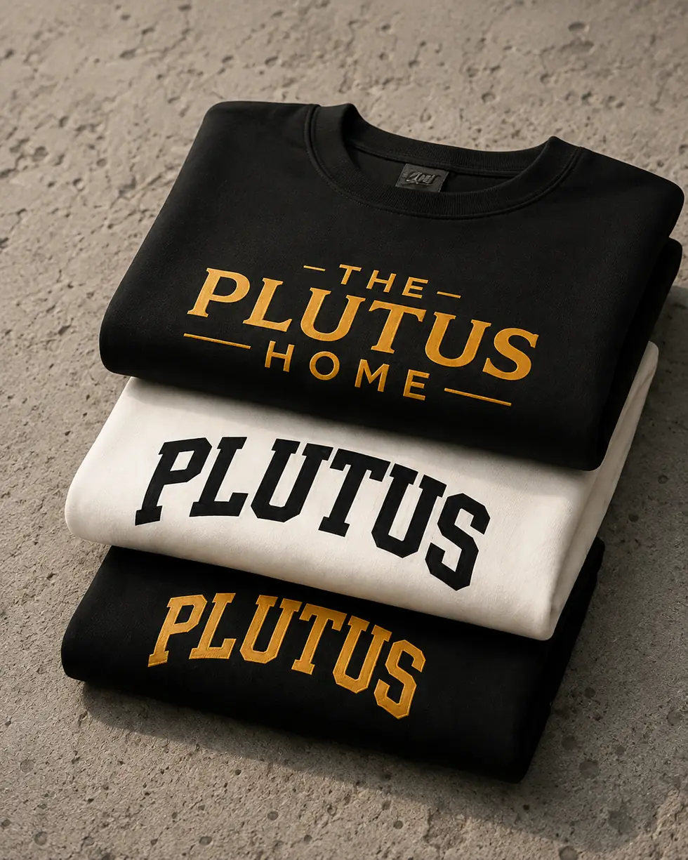 Three folded PLUTUS sweatshirts stacked on concrete.